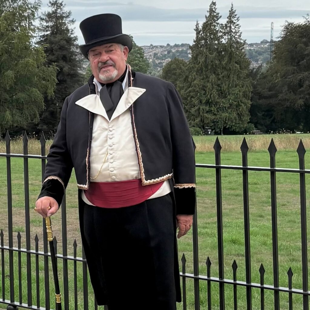 A man wearing a Regency costume and a top hat near the Royal Crescent during the Jane Austen Festival