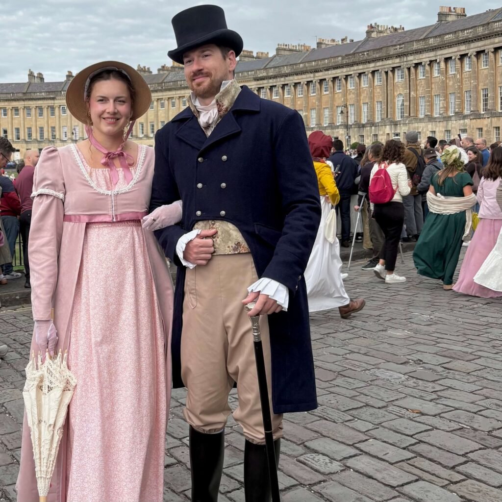 Regency-costumed couple posing for a photo at the Jane Austen Festival in Bath