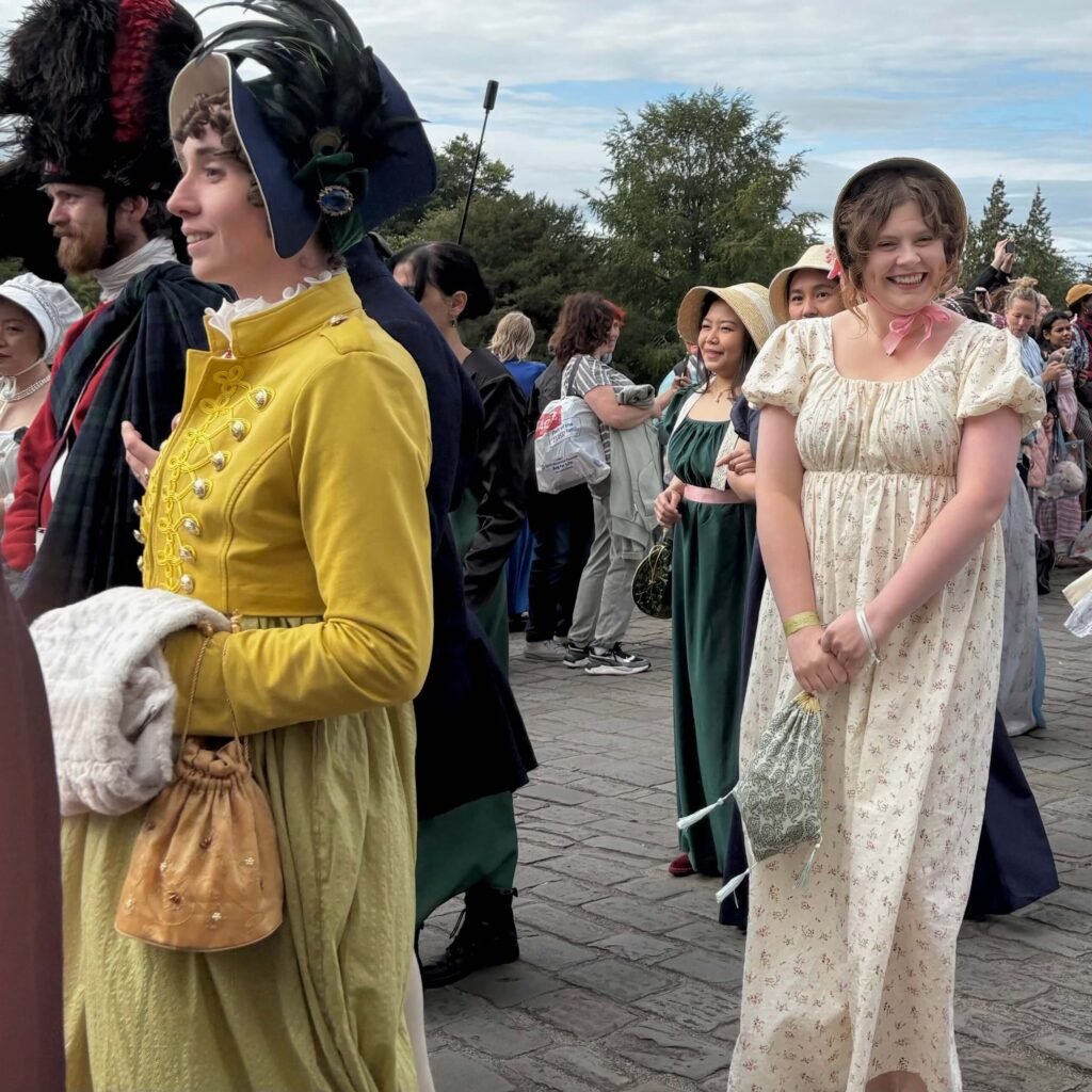 Women in Regency dresses taking part in the Jane Austen Festival parade in Bath