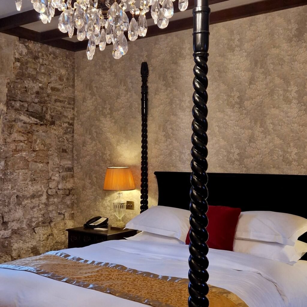 Dog-friendly bedroom at Thornbury Castle, a historic hotel in Gloucestershire